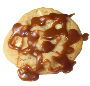 White chocolate chip cookie with macadamia nuts and a caramel drizzle.